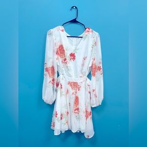 Sassy White Floral Dress with open back and cut out sides.